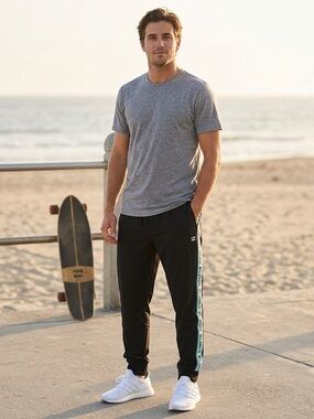 Billabong black loungewear jogger pants,  turquoise side logo tape, size large.
